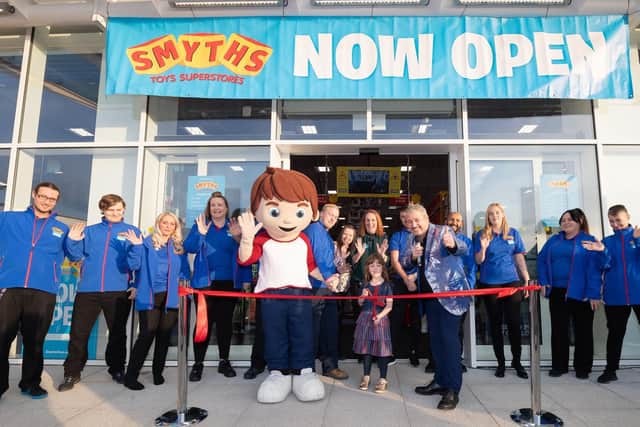 Mia Hillier opens the store. Proud Mum Mel, Store manager, behind her looks on. Picture: Keith Woodland (091119-15)