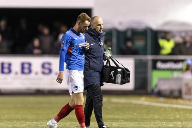 Tom Naylor is forced to leave the pitch with a hamstring injury in last night's 2-1 victory at Harrogate. Picture: Daniel Chesterton/PinPep