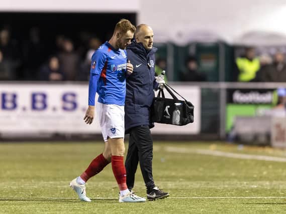 Tom Naylor is forced to leave the pitch with a hamstring injury in last night's 2-1 victory at Harrogate. Picture: Daniel Chesterton/PinPep