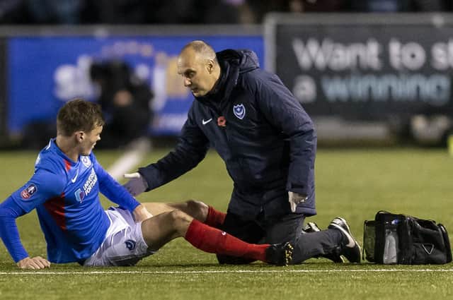 Sean Raggett was forced off injured during Pompey's FA Cup win at Harrogate Town. Picture: Daniel Chesterton/PinPep