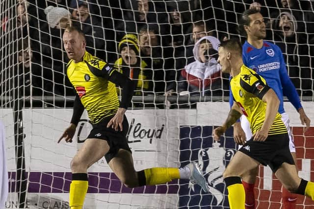 Mark Beck celebrates scoring for Harrogate Town after Pompey were again punished from a dead-ball situation on Monday evening. Picture: Daniel Chesterton/PinPep
