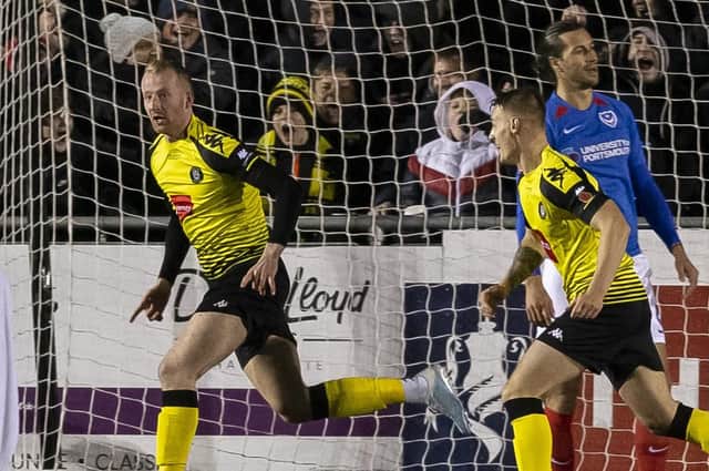 Mark Beck celebrates scoring for Harrogate Town after Pompey were again punished from a dead-ball situation on Monday evening. Picture: Daniel Chesterton/PinPep
