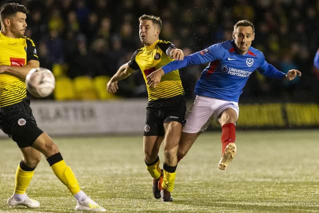 Brandon Haunstrup curls home Pompey's equaliser at Harrogate. Picture: Daniel Chesterton