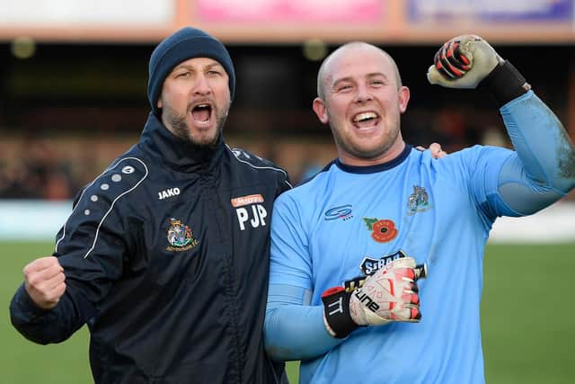 Altrincham boss Phil Parkinson celebrates with keeper Anthony Thompson following the Robins' FA Cup victory at York  Picture: George Wood/Getty Images