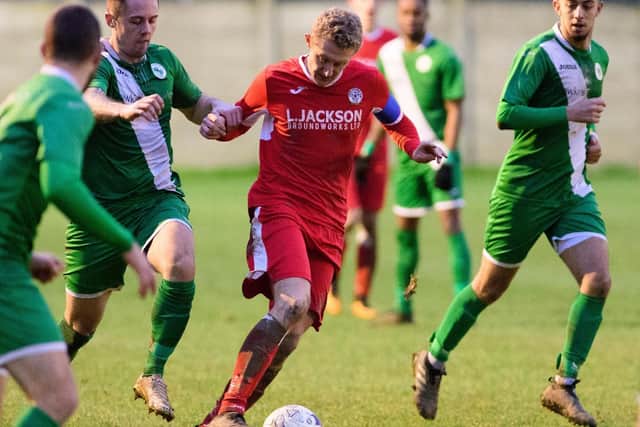 Ash Howes (red) was praised by Horndean boss Michael Birmingham following the 4-1 win over Wessex leaders Alresford