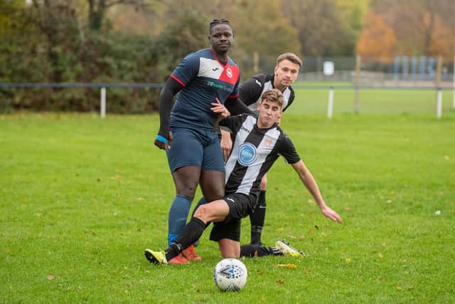 Paulsgrove's Moulay Osman is challenged by Hayling pair Ben Metherall and Will Ford