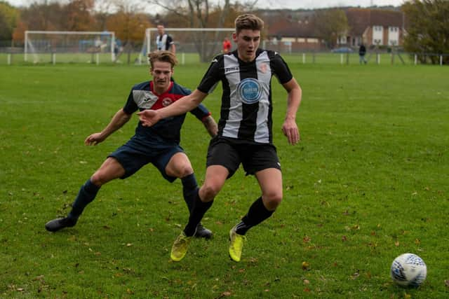 Paulsgrove's Reece Lewis and Hayling's Ben Metherell