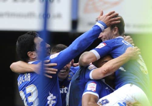 Pompey players mob David Connolly after his second goal. Picture: Ian Hargreaves (13689-15)