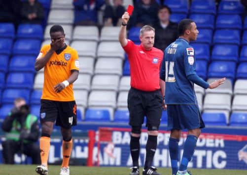 Pompey's Sam Sodje is shown a red card at Oldham    Picture: Joe Pepler