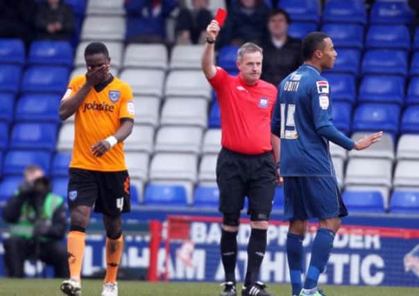 Pompey's Sam Sodje is shown a red card at Oldham    Picture: Joe Pepler
