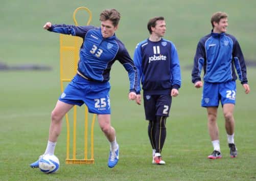 Alex Grant, left, during Pompey training. Picture: Sarah Standing (1372-1390)
