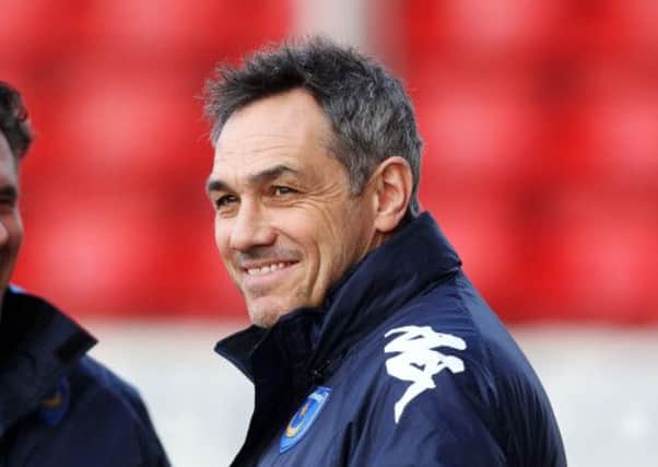 It's been happier times for Guy Whittingham and his Pompey squad in recent weeks    Picture: Joe Pepler