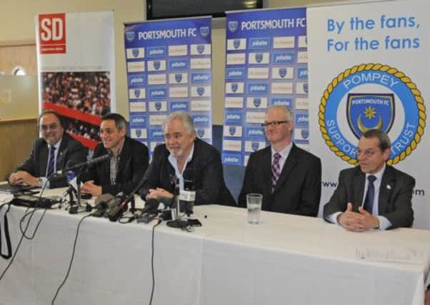 New Pompey chairman, Iain McInnes, centre, is accompanied by fellow board  members, Mark Trapani, left, Ashley Brown, second from right, and Mick Williams, right, at the unveiling of Guy Whittingham, second from left, as new permanent Blues  manager at Fratton Park yesterday