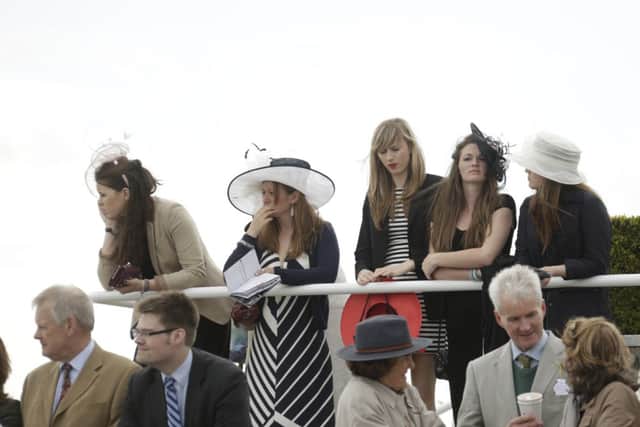 It was a sunny and showery day for the crowd at the opening day of the Goodwood May Festival  Picture by Clive Bennett