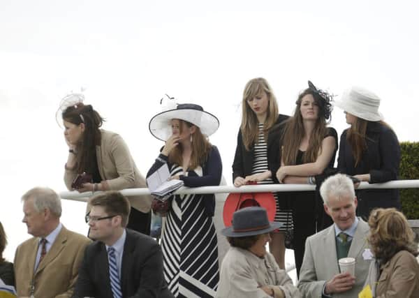 It was a sunny and showery day for the crowd at the opening day of the Goodwood May Festival  Picture by Clive Bennett