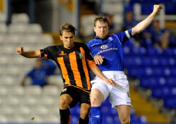 Ricky Holmes, left, is a Pompey target