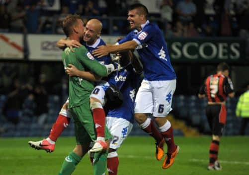 The Pompey players celebrate penalty shootout success over Bournemouth in the Johnstones Paint Trophy last season at Fratton Park