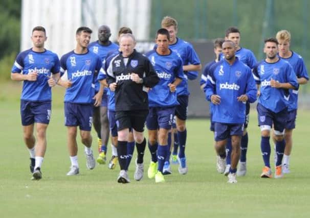 The Pompey players are put through their paces by Alan McLoughlin during pre-season training