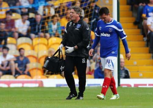 Marcos Painter hobbles off. Picture: Joe Pepler