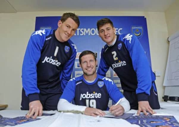 Jamie Ashdown, David Norris and Joel Ward, pictured here left to right as they signed up to the Pompey share scheme last year, are all owed money by the club
