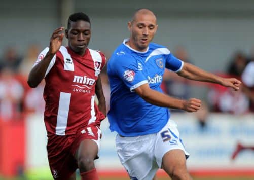 Jermaine McGlashan, left, snatched the late equaliser for Cheltenham