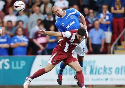 Joe Devera wins the ball to head clear. Picture: Joe Pepler
