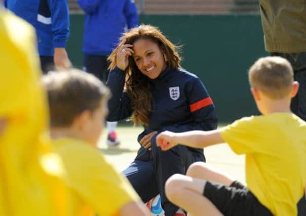 SUPPORT England Ladies player Alex Scott, pictured coaching at Medina Primary School in Cosham yesterday, is looking forward to playing at Fratton Park. Picture: Allan Hutchings (132551-097)