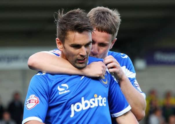 THRIVING Ricky Holmes, left, is congratulated by Simon Ferry after scoring against Burton Albion. Picture: Joe Pepler