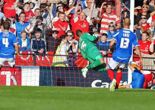 Wes Fletcher, far right, compunds Pompeys misery by scoring his second of the day past John Sullivan, as Danny East and Johnny Ertl look on Picture: Joe Pepler