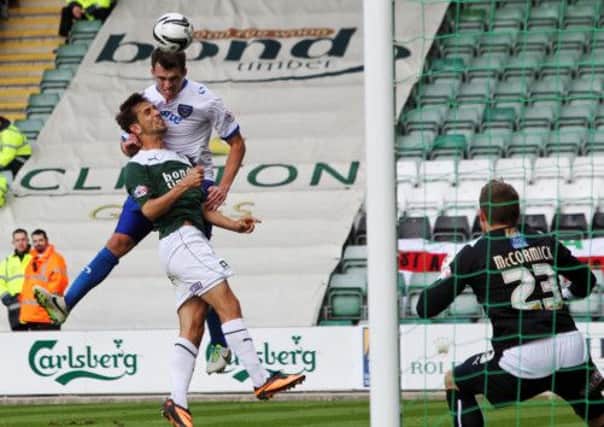 John Marquis heads just over the bar as Pompey push for a second-half winner. Picture: Joe Pepler