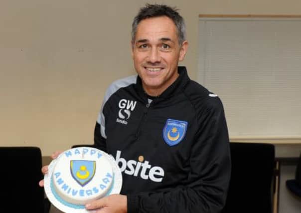 Guy Whittingham shows off the cake baked for him by News reporter and Pompey fan Ruth Scammell Picture: Allan Hutchings
