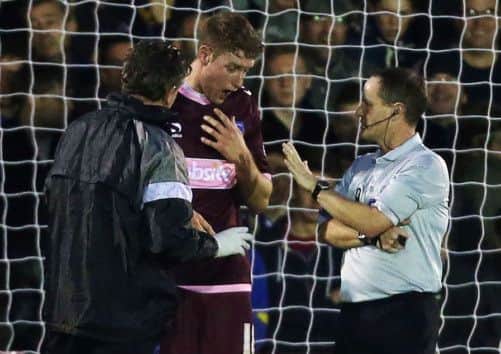Ryan Bird receives treatment from Steve Allen at being knocked out  Picture; Joe Pepler