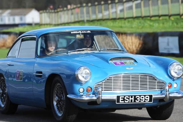 The Prince jumps behind the wheel of the first car - an Aston Martin C140205-8 PICTURES BY KATE SHEMILT
