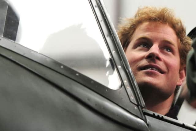 Prince Harry in the Spitfire cockpit at Goodwood    Picture by Kate Shemilt C140205-77