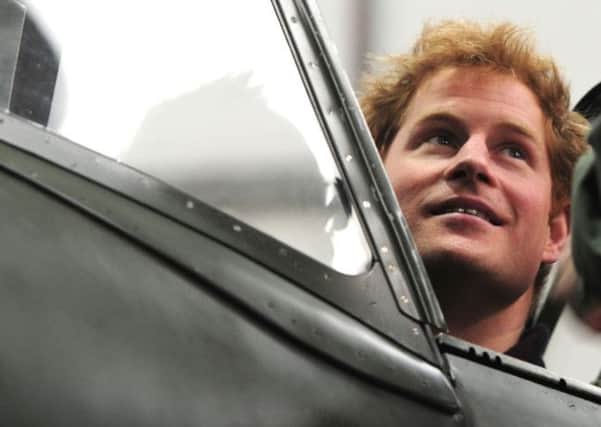 Prince Harry in the Spitfire cockpit at Goodwood    Picture by Kate Shemilt C140205-77