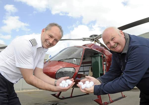Atlas Helicopters duo Mike Burns and Roy Adams get ready for the drop Picture by Ian Hargreaves