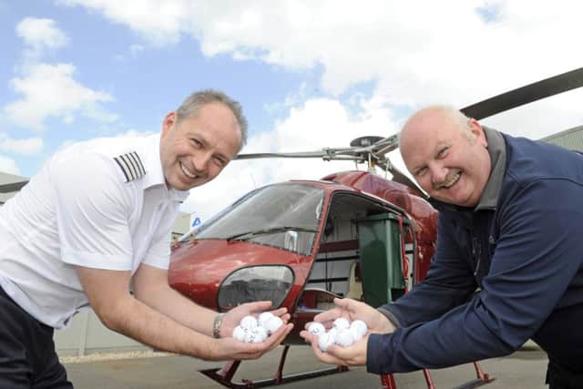 Atlas Helicopters duo Mike Burns and Roy Adams get ready for the drop   Picture by Ian Hargreaves