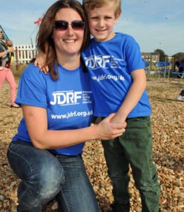 28/09/14  RSFriends and family of little Morgan Wheller who has diabetes, take part in a walk along Hayling Island sea front to raise money for diabetes research. Mum Faye with her son Morgan.Picture: Ian Hargreaves (142722-4) PPP-140928-163921003