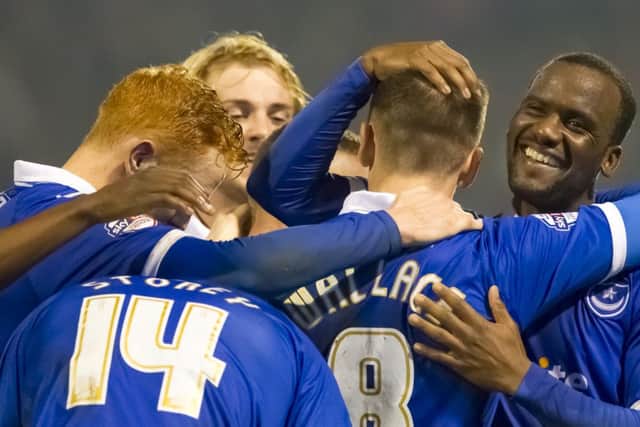 Pompey celebrate as they score their third goal in the 3-0 win against Morecambe