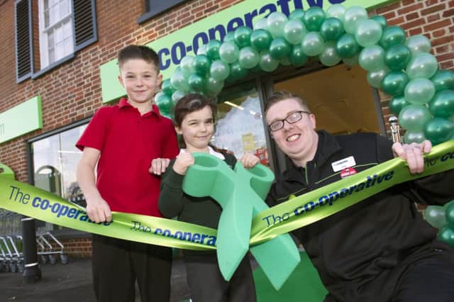 Jenny Lawley and Dan Lewis from Mengham Infant and Junior Schools open the new Co-operative in Selsmore Road Hayling Island with store manager Chris Fallon. Picture: Steve Reid Blitz Photography