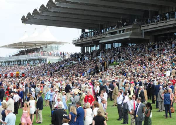 Crowds enjoy Glorious Goodwood in 2014 Picture by Kate Shemilt C140777-20