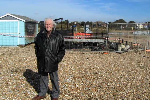 Fred Cummings, 75, from Bedhampton, next to his beach hut on Hayling beach that has been burned down.Picture: Jeff Travis