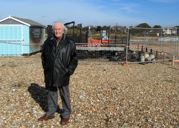 Fred Cummings, 75, from Bedhampton, next to his beach hut on Hayling beach that has been burned down.

Picture: Jeff Travis