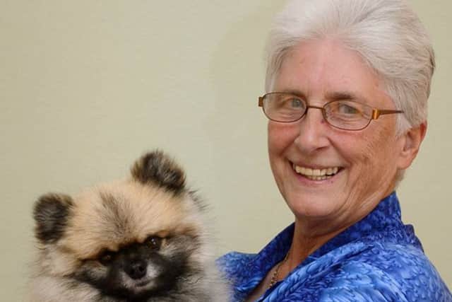 Andy Rosholm-Olesen at home with her pet dog
