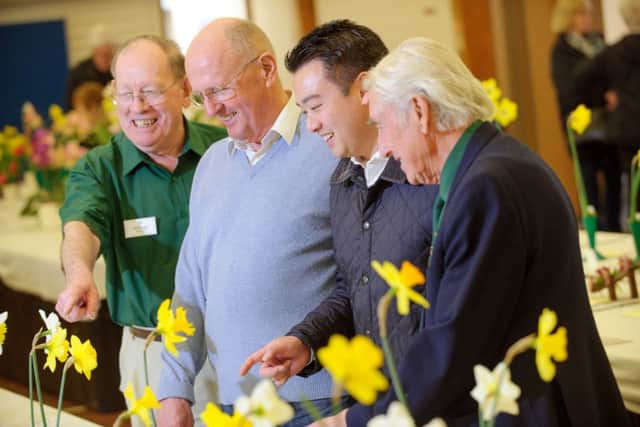 BLOOMING GREAT Bill Biggs, Cllr Alan Lenaghan, Alan Mak and Ray Jones, looking at the exhibits (150615-703)