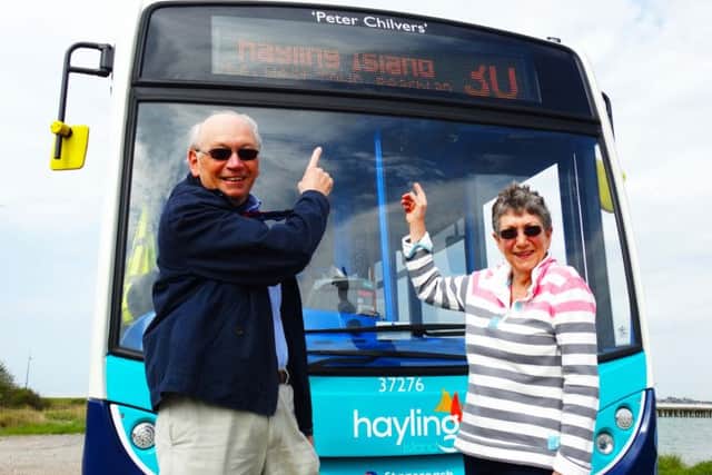 Gil & Carol Carter with the bus named 'Peter Chilvers'.