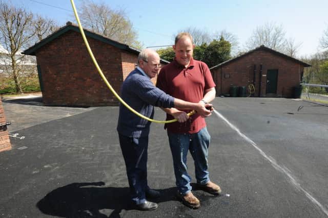 Seamus Buckley and head groundsman Sean Martin at the new washdown area at Goodwood Picture by Kate Shemilt KS1500017-2