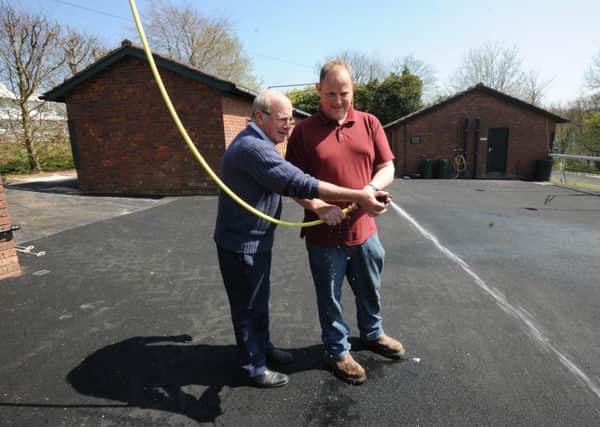Seamus Buckley and head groundsman Sean Martin at the new washdown area at Goodwood Picture by Kate Shemilt KS1500017-2
