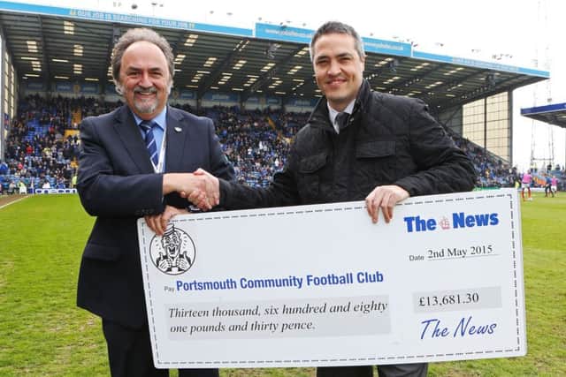 News sports writer Steve Wilson, right, presents a cheque for £13,681.30 to Pompey director Mark Trapani Picture: Joe Pepler