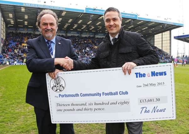 News sports writer Steve Wilson, right, presents a cheque for £13,681.30 to Pompey director Mark Trapani Picture: Joe Pepler